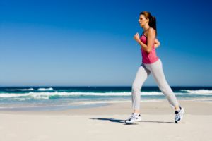 Improve your health - Woman jogging on beach - images.jpg